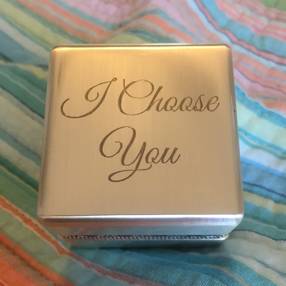 Silver tone ring box.